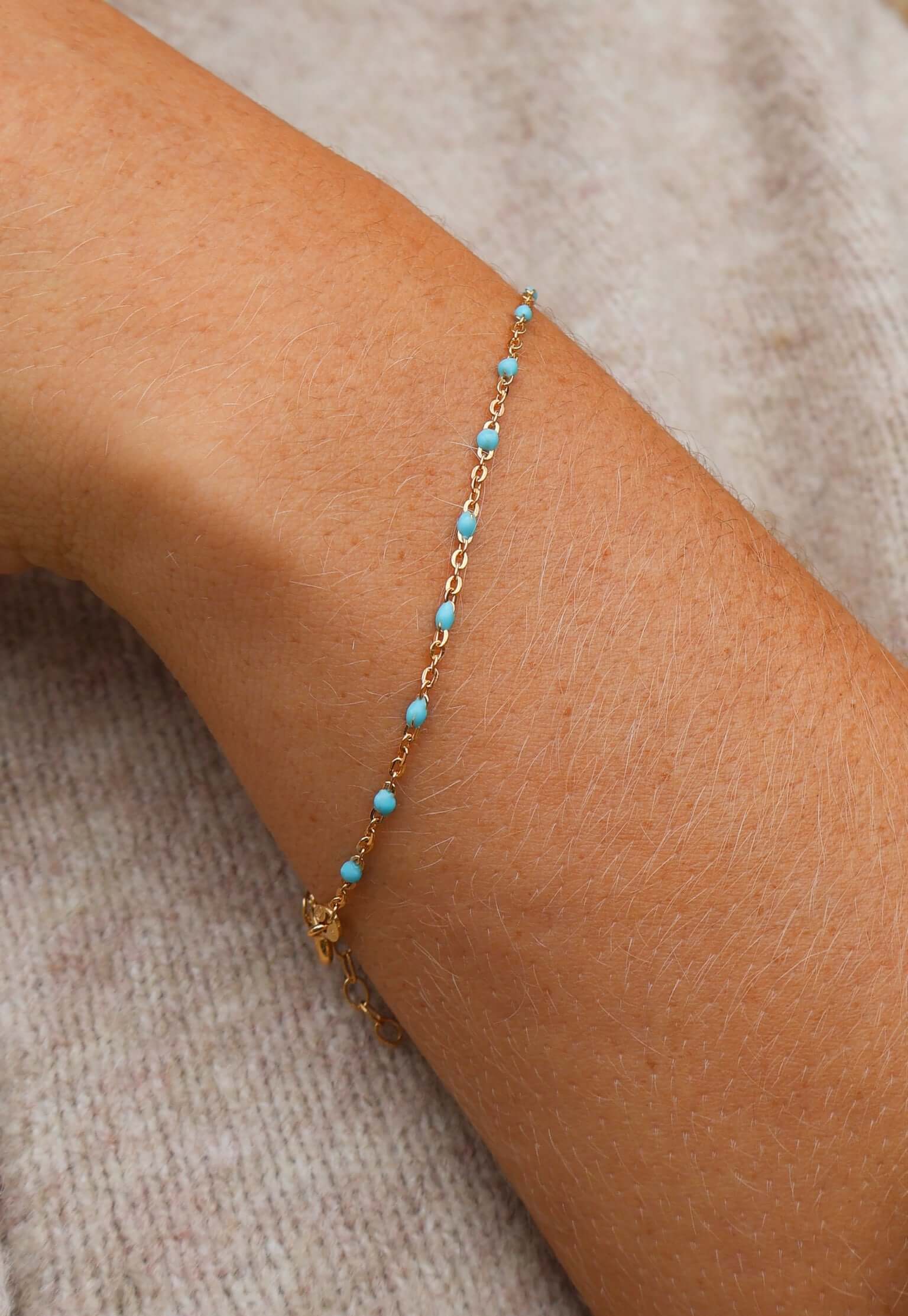 14k Gold Turquoise Beaded Bracelet on a wrist, showcasing ocean-inspired color and adjustable length.