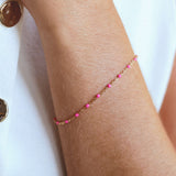14k Gold-Filled Pink Beaded Bracelet on a wrist, showcasing blush pink beads on a delicate gold chain for a feminine touch.