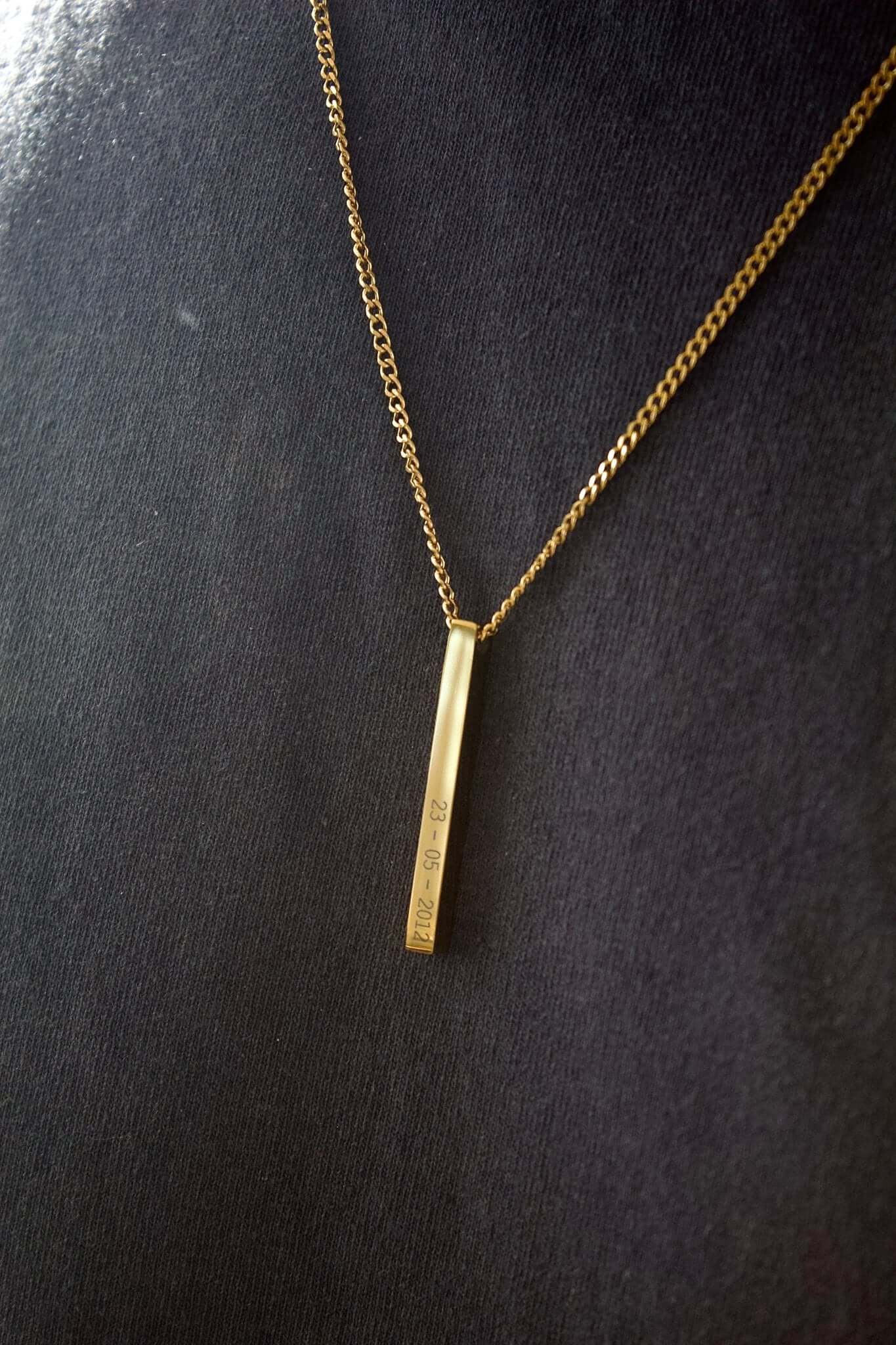 Gold personalised bar necklace showcasing elegance with engraved details, perfect for gifting special moments.