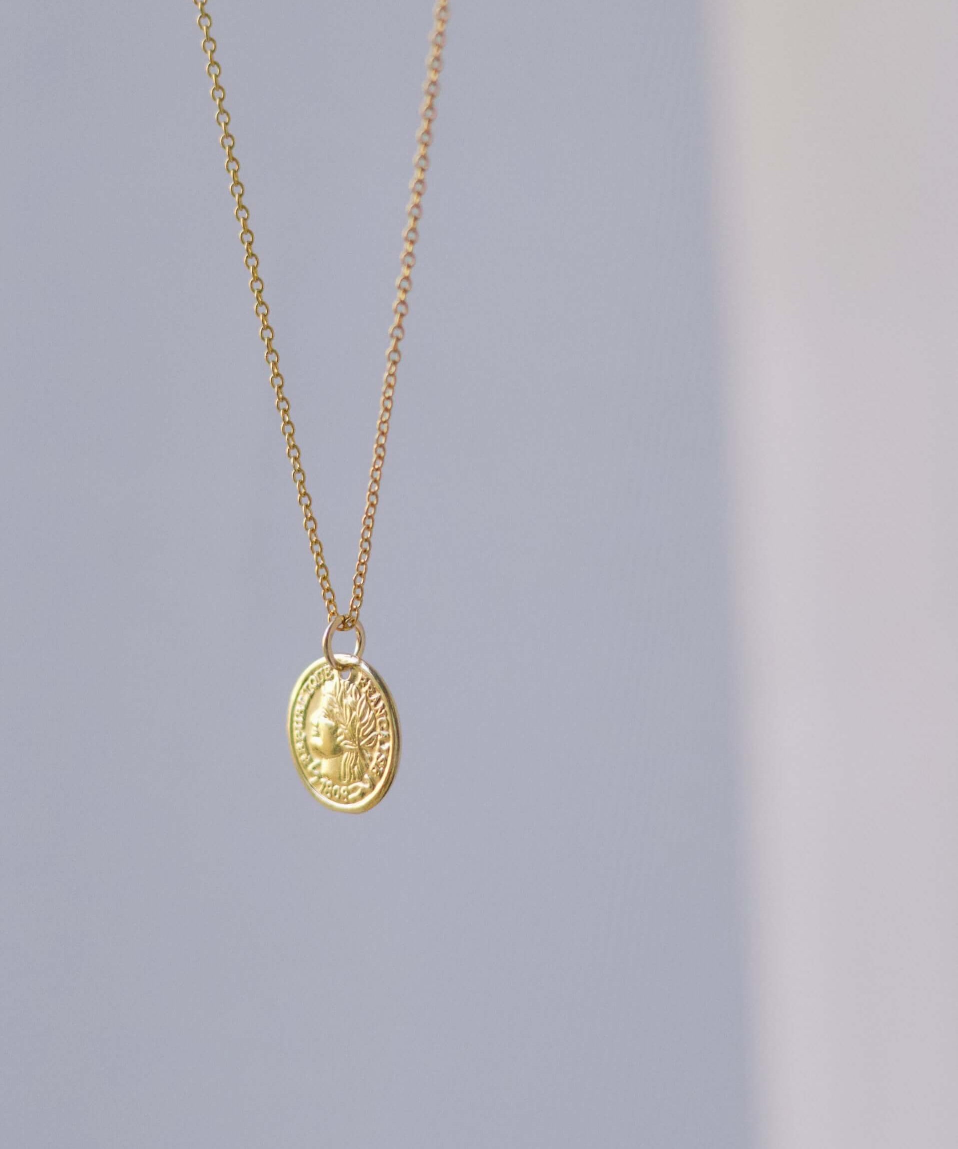 14k Gold Coin Necklace featuring an 1808 Republique Francoise charm, luxurious design perfect for style elevation.