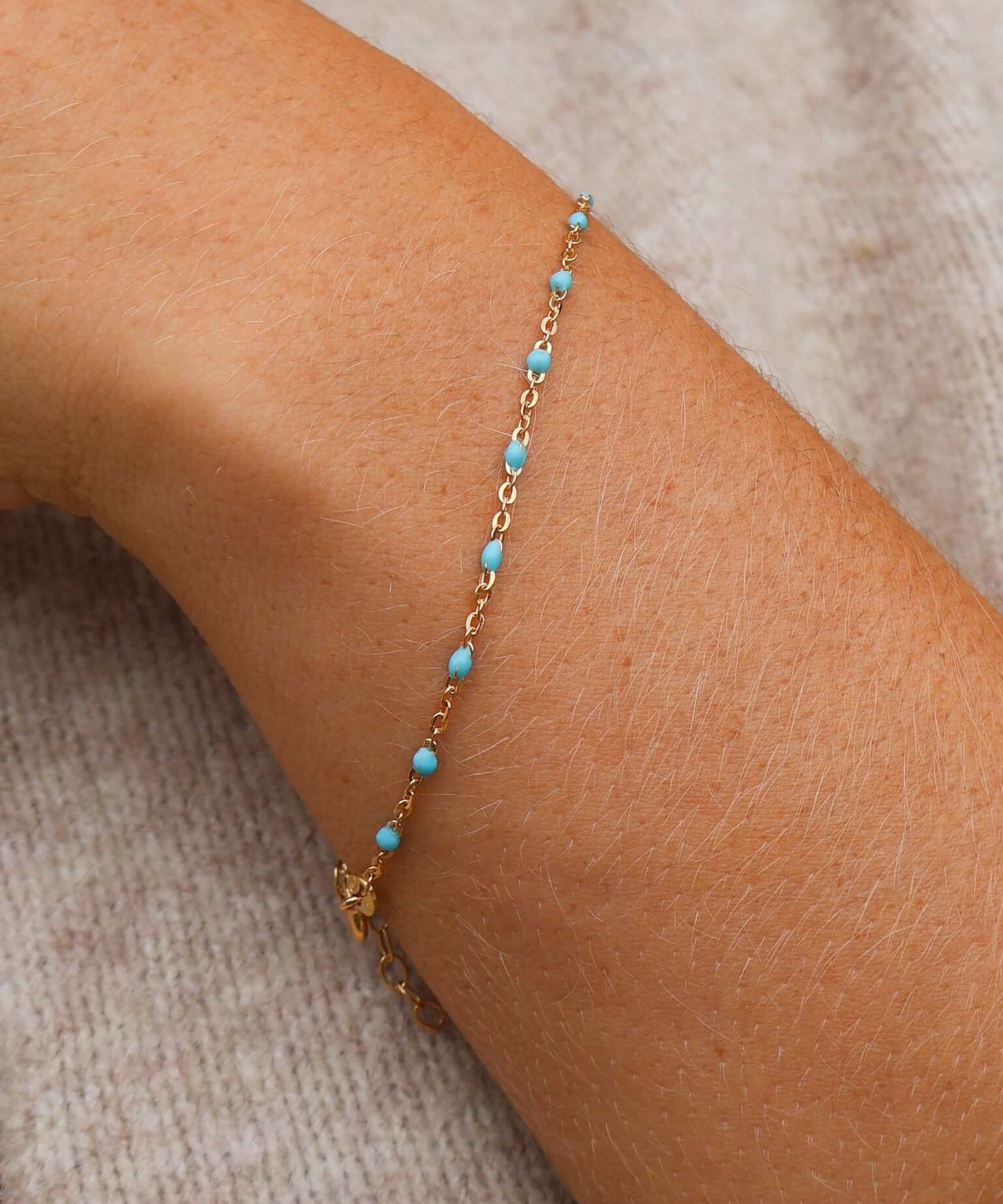 14k Gold Turquoise Beaded Bracelet on a wrist, showcasing ocean-inspired color and adjustable length.