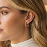 Woman wearing a white turtleneck sweater with a blurred background