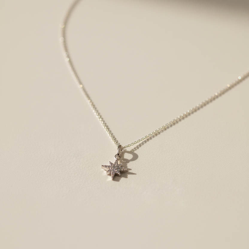 Necklace with a star-shaped pendant on a light beige background