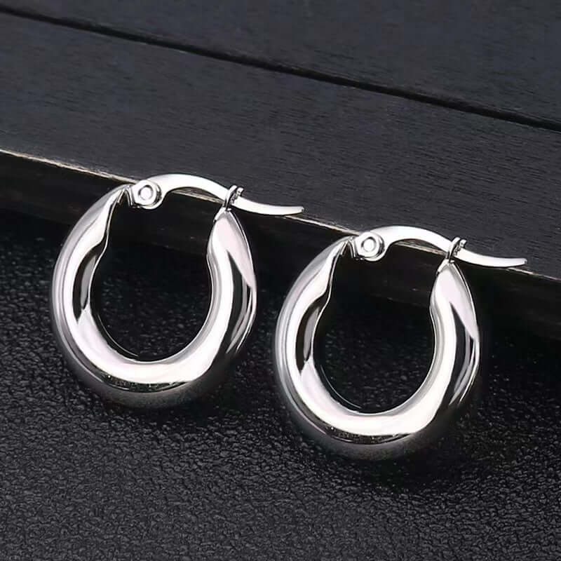 Chunky silver hoop earrings crafted from premium stainless steel, perfect for everyday wear and special occasions.
