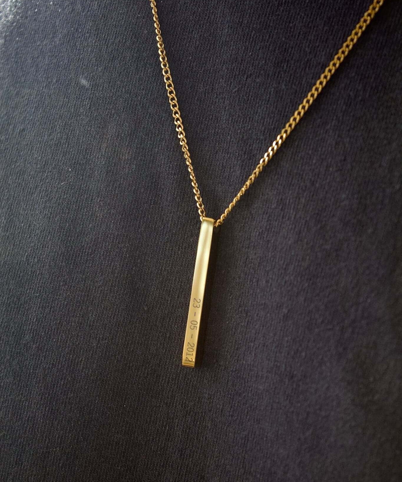 Gold personalised bar necklace showcasing elegance with engraved details, perfect for gifting special moments.