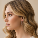 Woman wearing silver hoop earrings